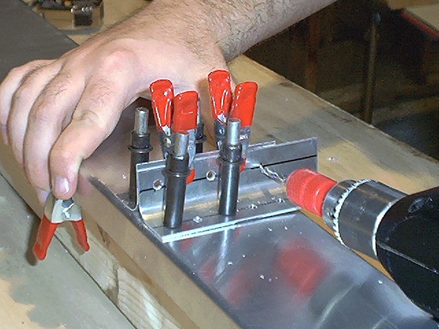 Drilling and clecoing the bracket to its doubler.