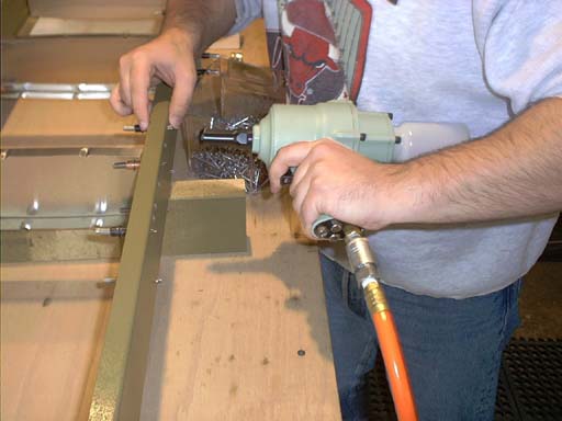 Pneumatic Rivet Gun.  There IS no substitute.