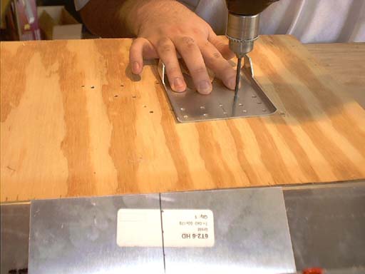 Pre-drilling the attachment plate.